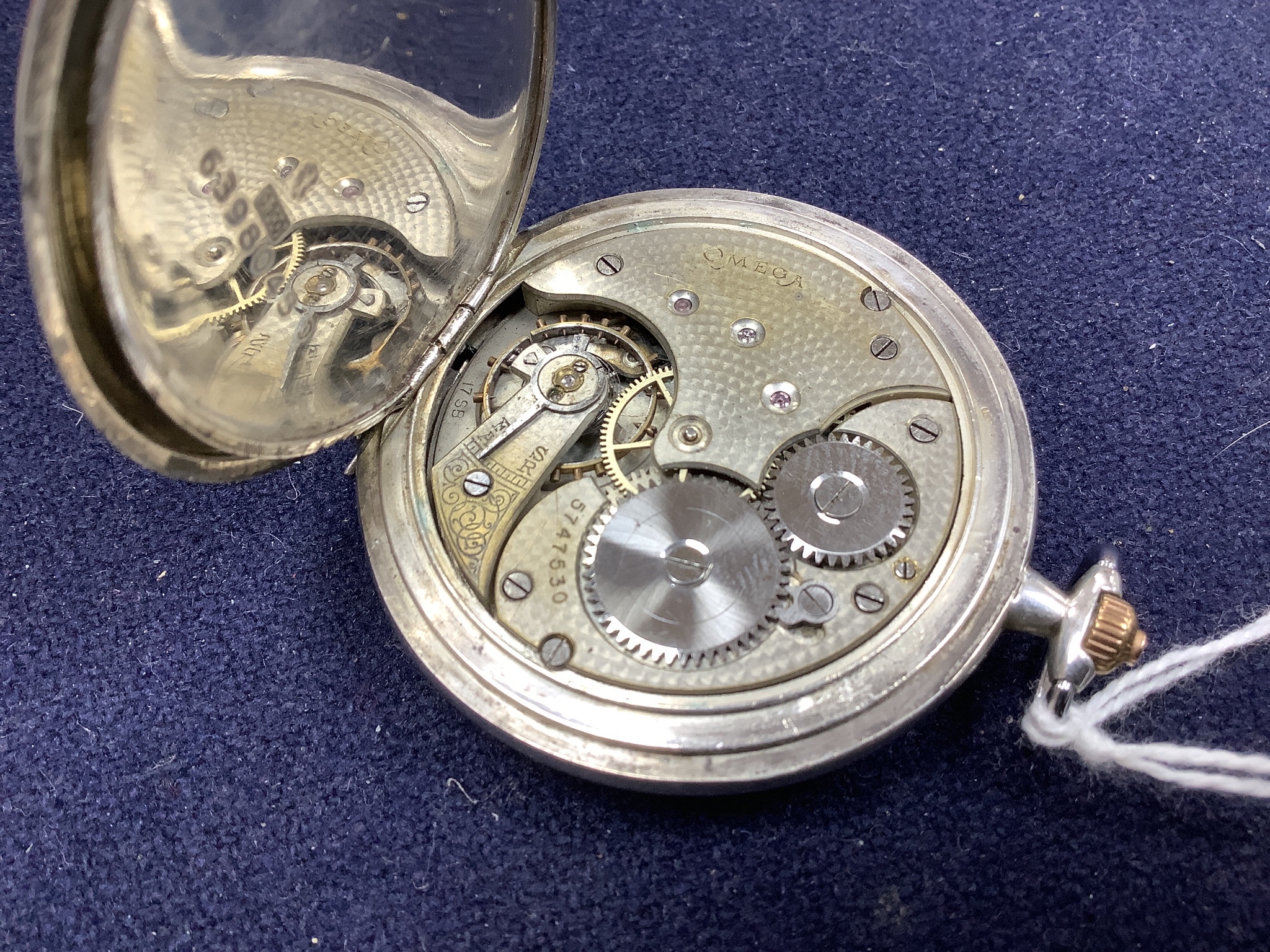 An Omega keyless silver hunter pocket watch in 900 standard case, lid associated.